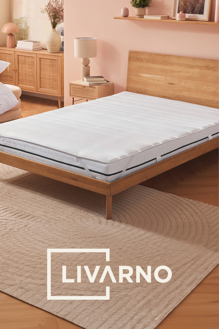 Bedroom with a bed, mattress topper, and a rug. LIVARNO text in a white frame.