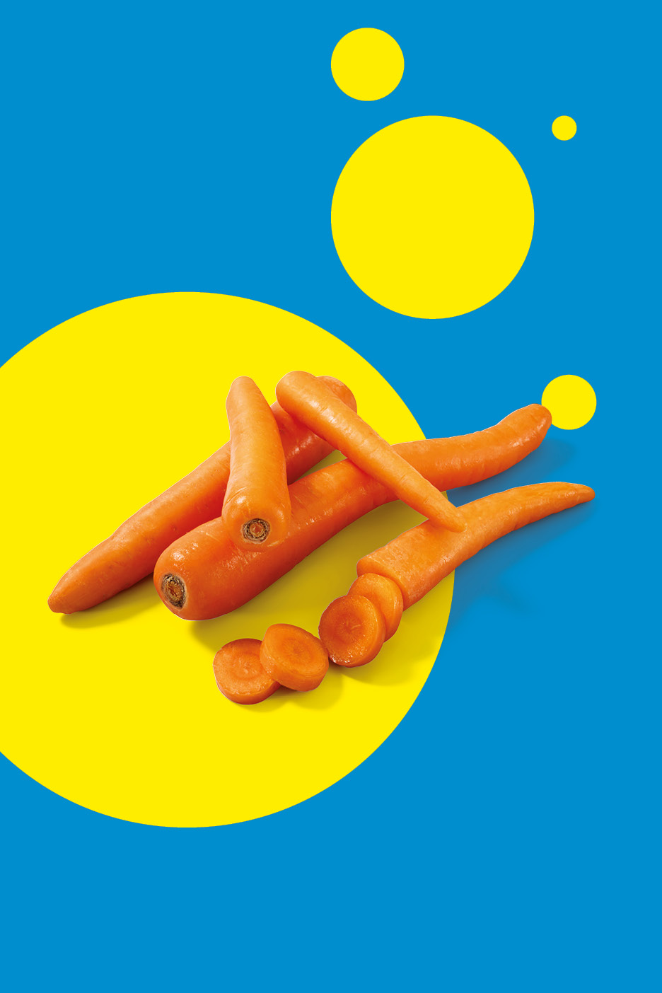 Fresh carrots, some whole and some sliced, on a blue and yellow background.