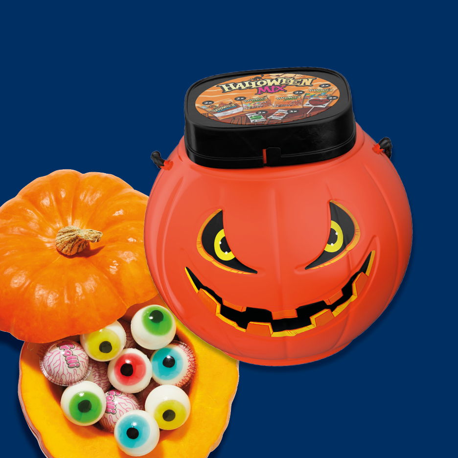 A Halloween pumpkin bucket with a candy mix lid, next to a pumpkin filled with eyeball candies.