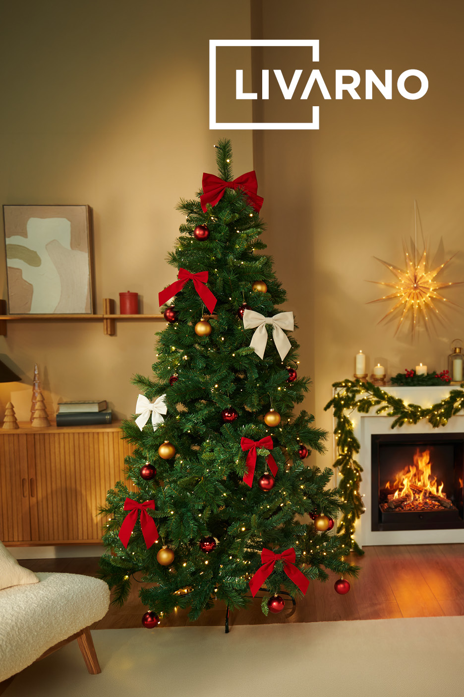 A decorated artificial Christmas tree with red and white bows in a cozy living room.