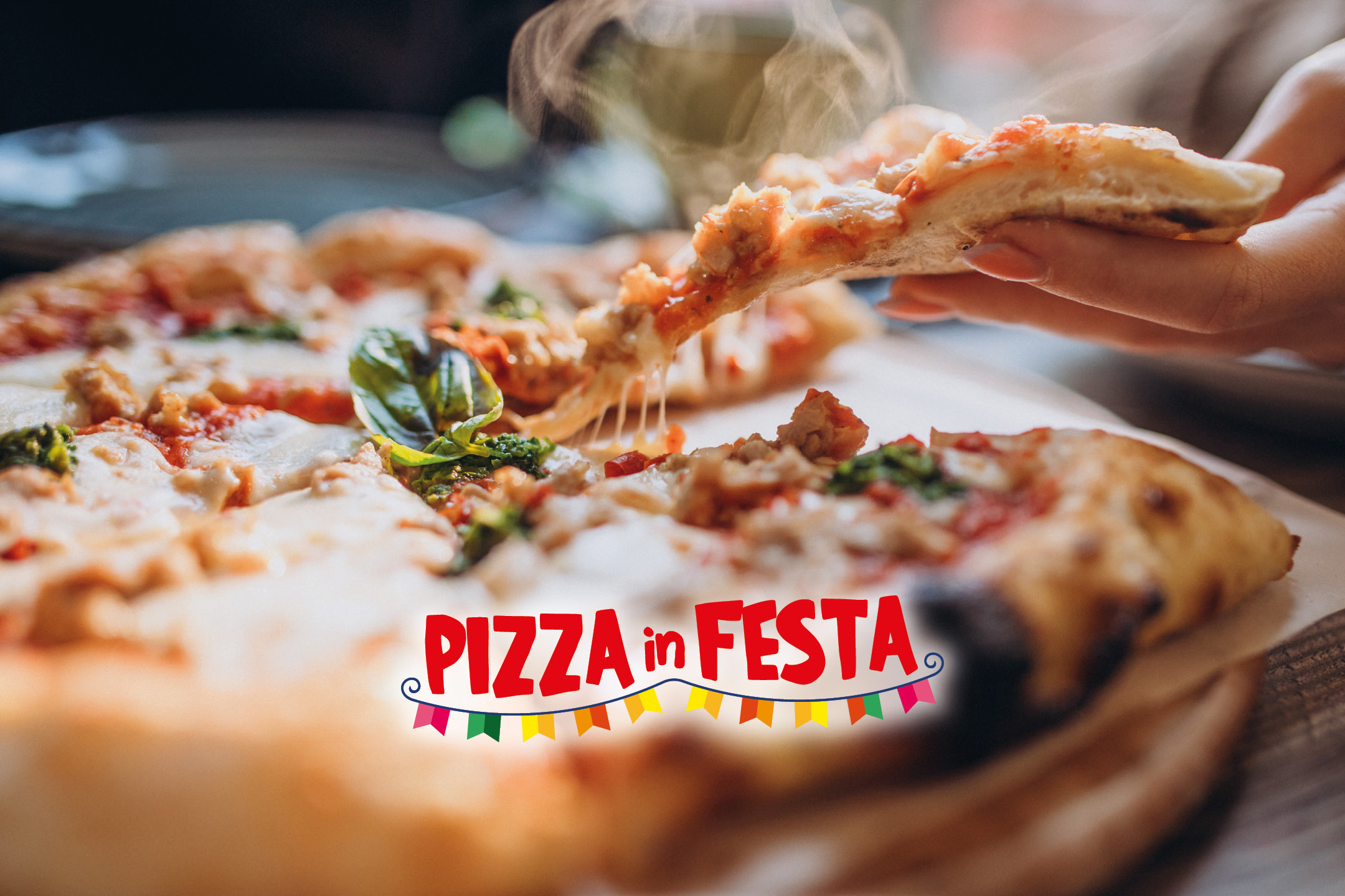 A hand holding a slice of hot, cheesy pizza with the text 'PIZZA in FESTA' and festive flags.