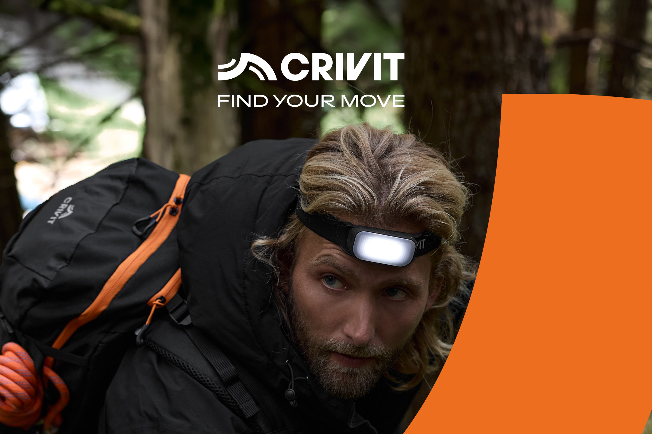Man with a headlamp and backpack, hiking in a forest. Text: CRIVIT FIND YOUR MOVE.