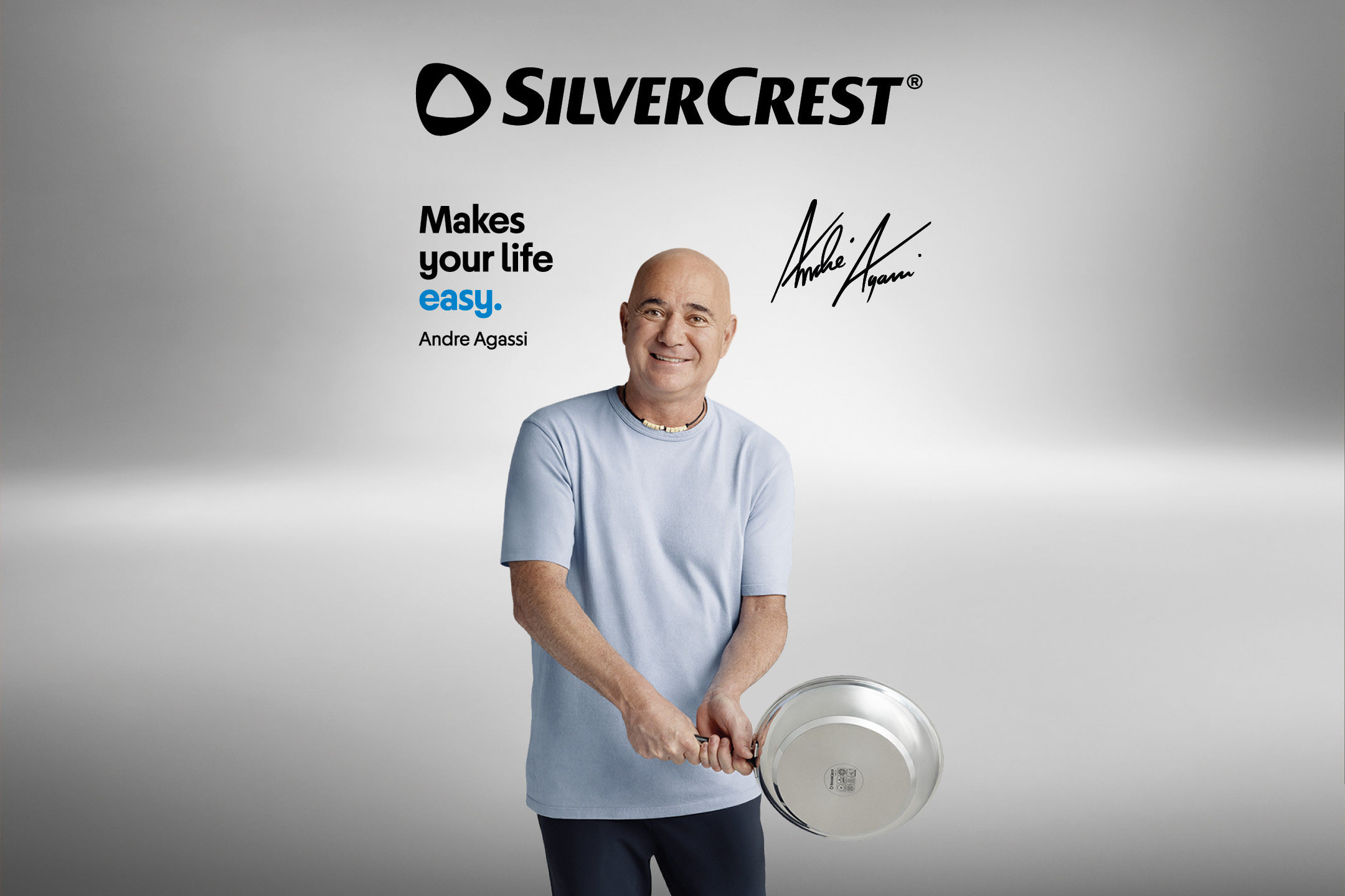 Andre Agassi holding a frying pan, with text 'Makes your life easy' and his signature.