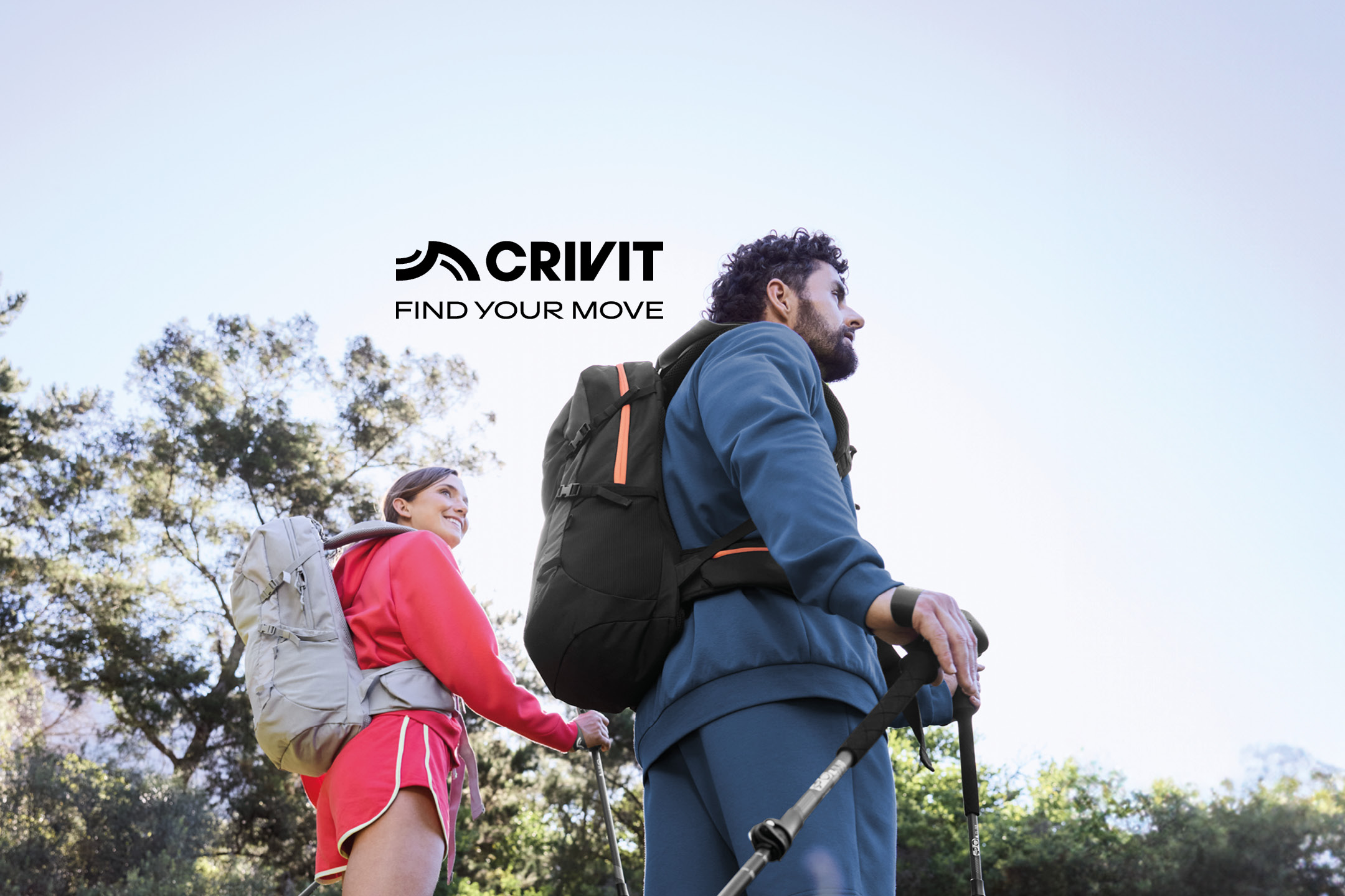 Two hikers with backpacks and trekking poles, with text: 'FIND YOUR MOVE'