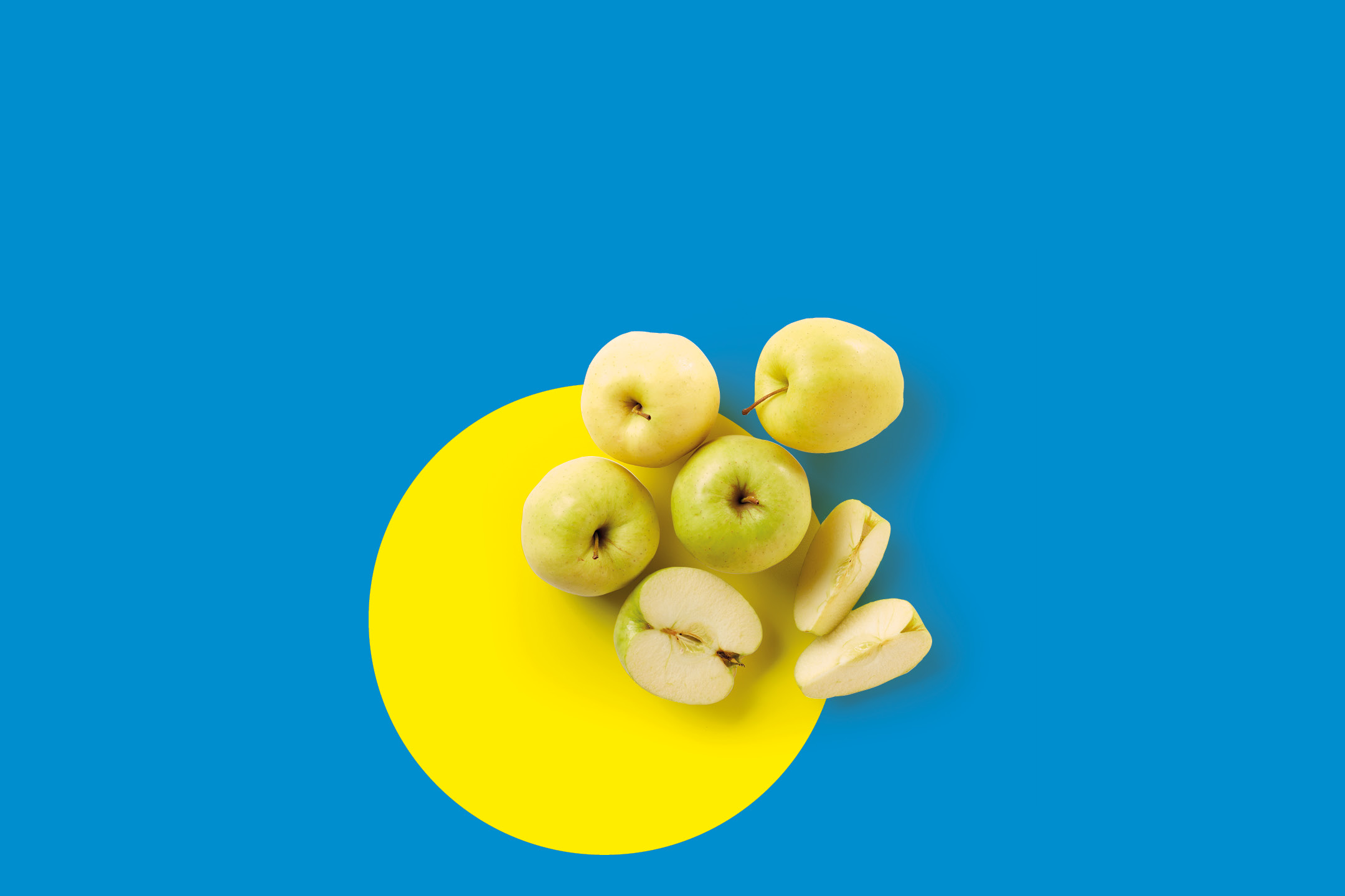 Green and yellow apples, whole and sliced, on a blue and yellow background.