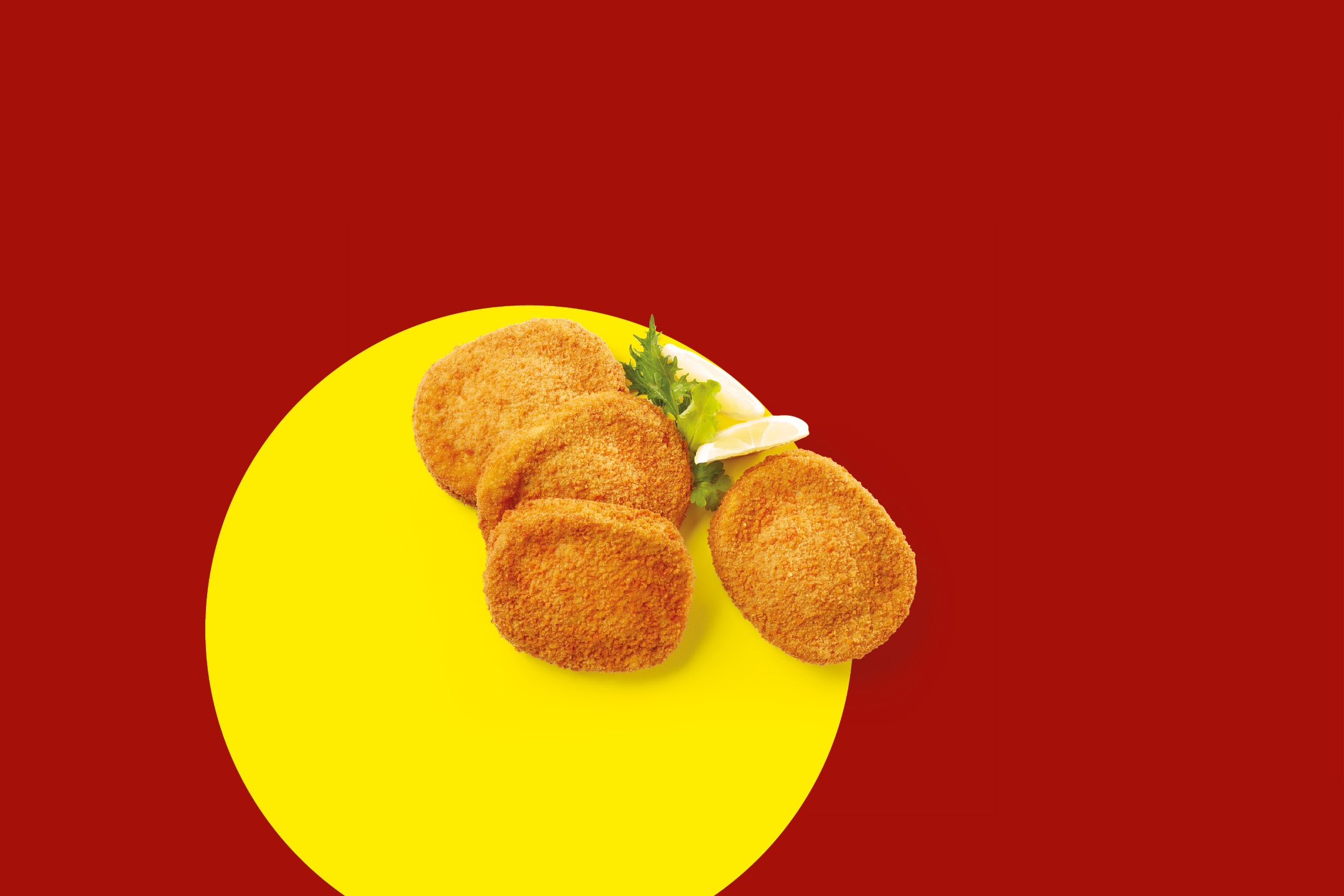 Breaded cutlets with lemon and parsley on a yellow circle against a red background.