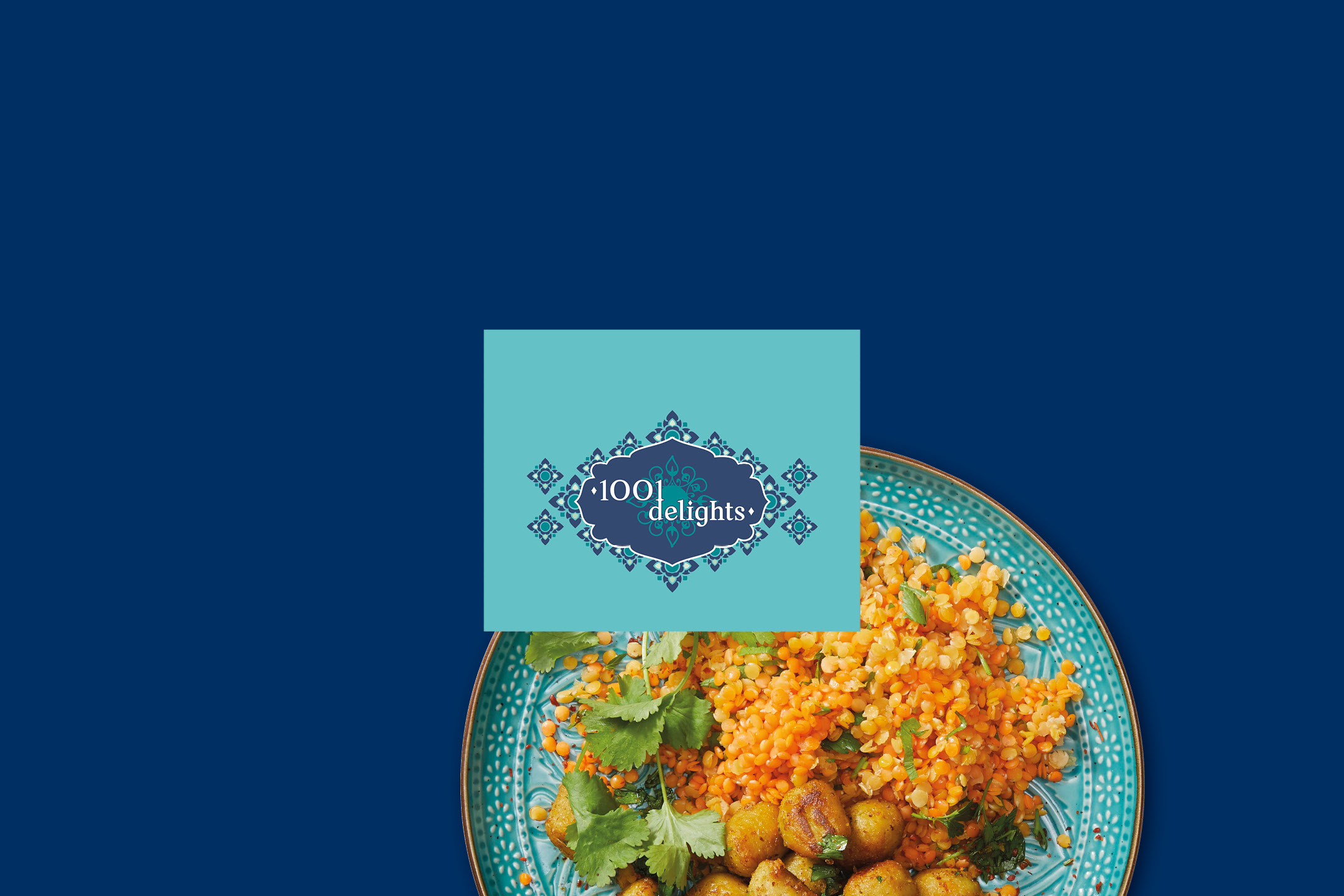 A plate of golden potatoes and orange lentils with herbs, with a blue and teal logo overlay.