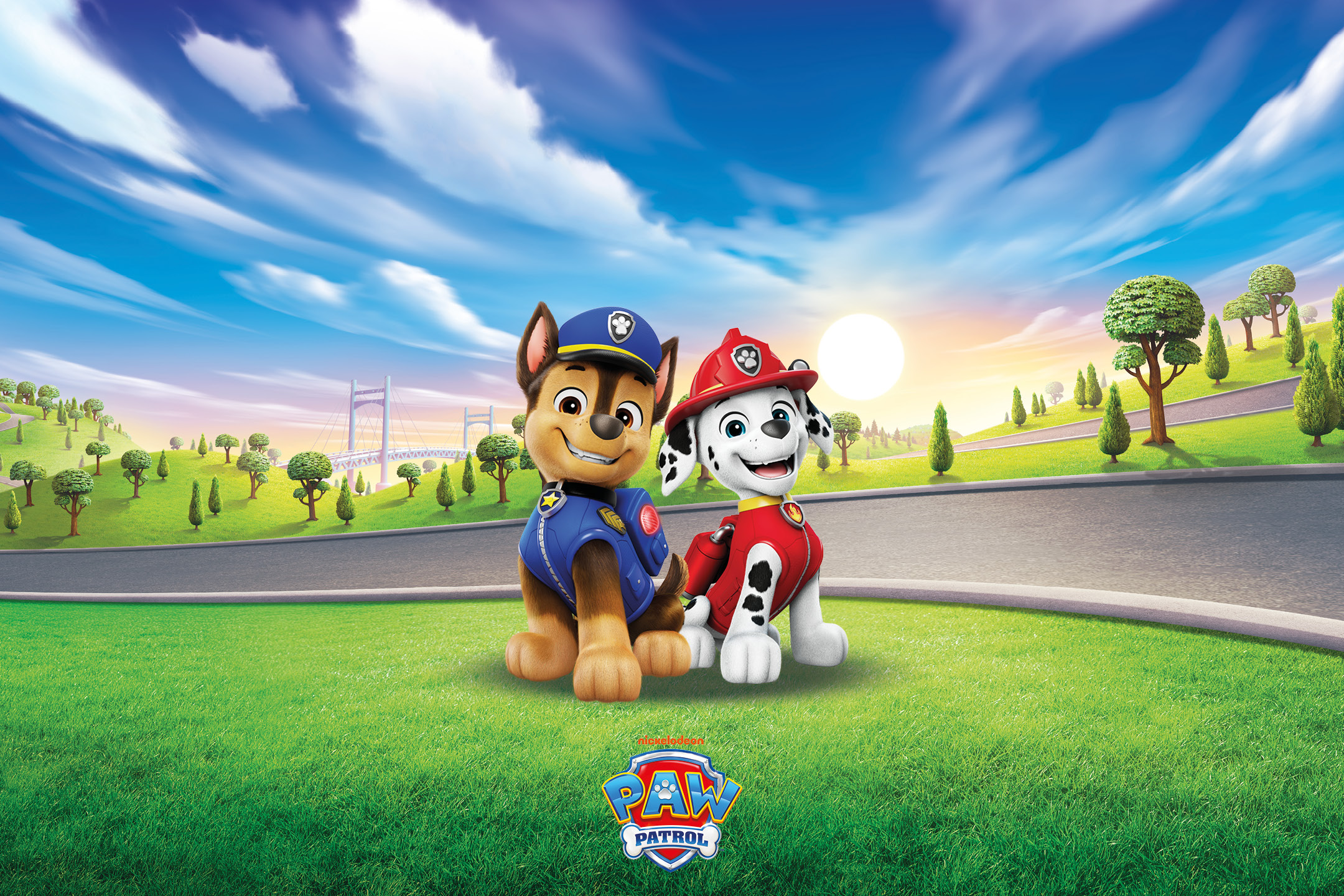 Two cartoon dogs, one in a police uniform and one in a firefighter uniform, with a tower and bridge in the background.