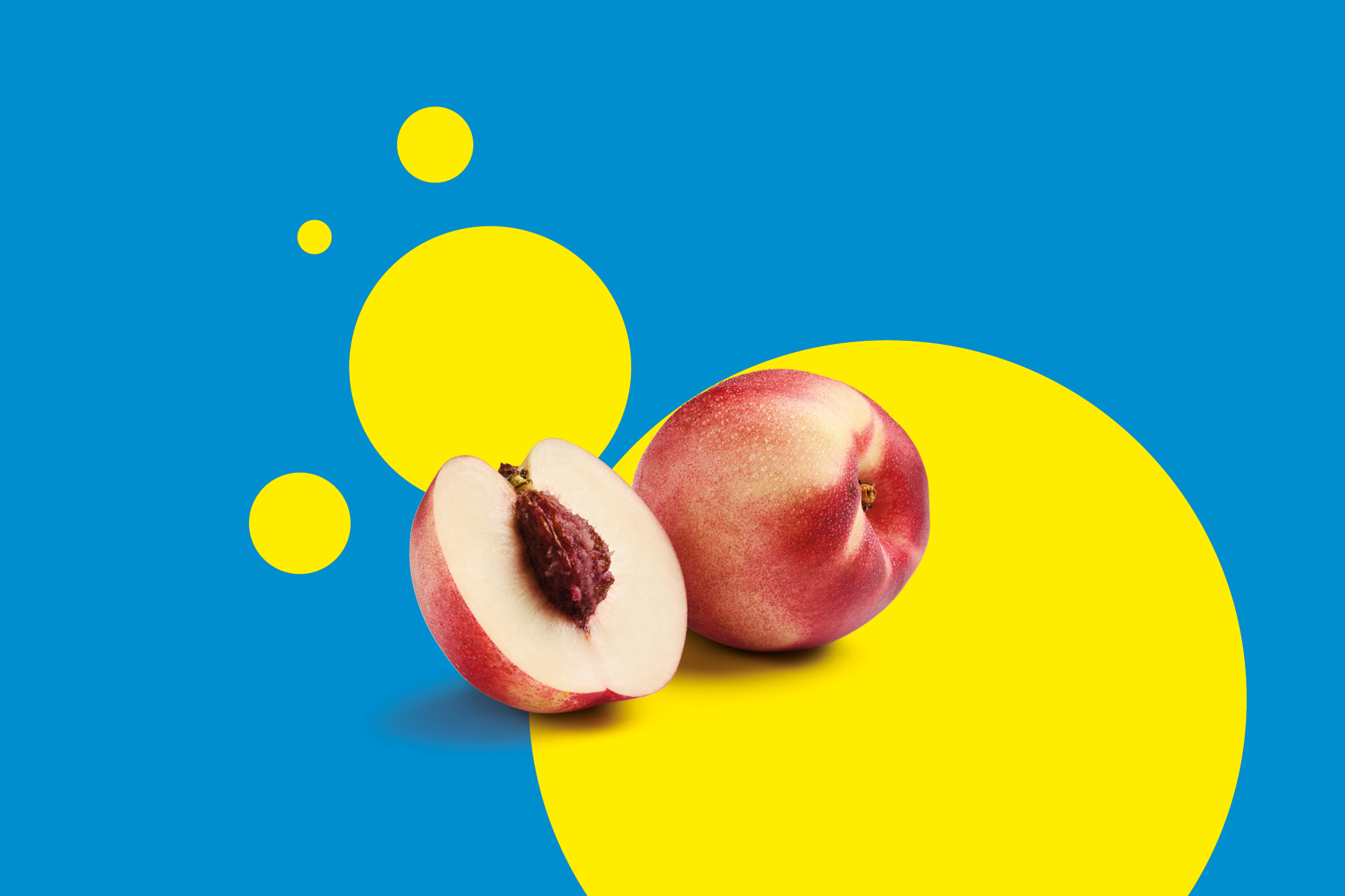 Two fresh nectarines, one whole and one halved, on a blue background with yellow circles.