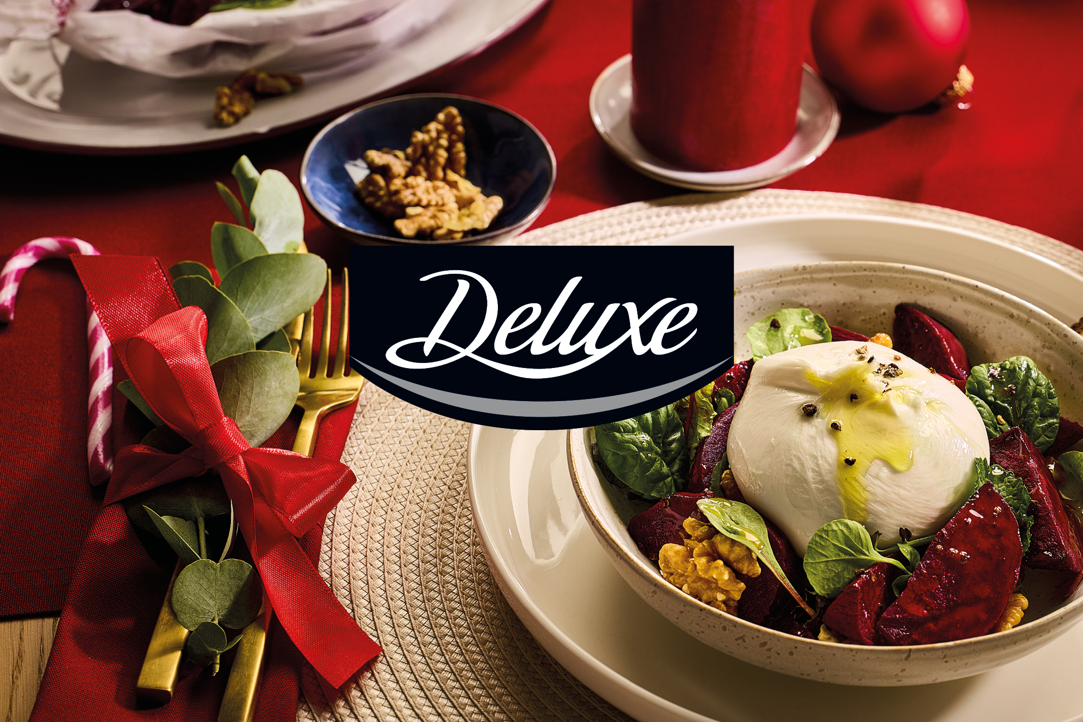 Deluxe burrata salad with beetroot and walnuts on a festive table.