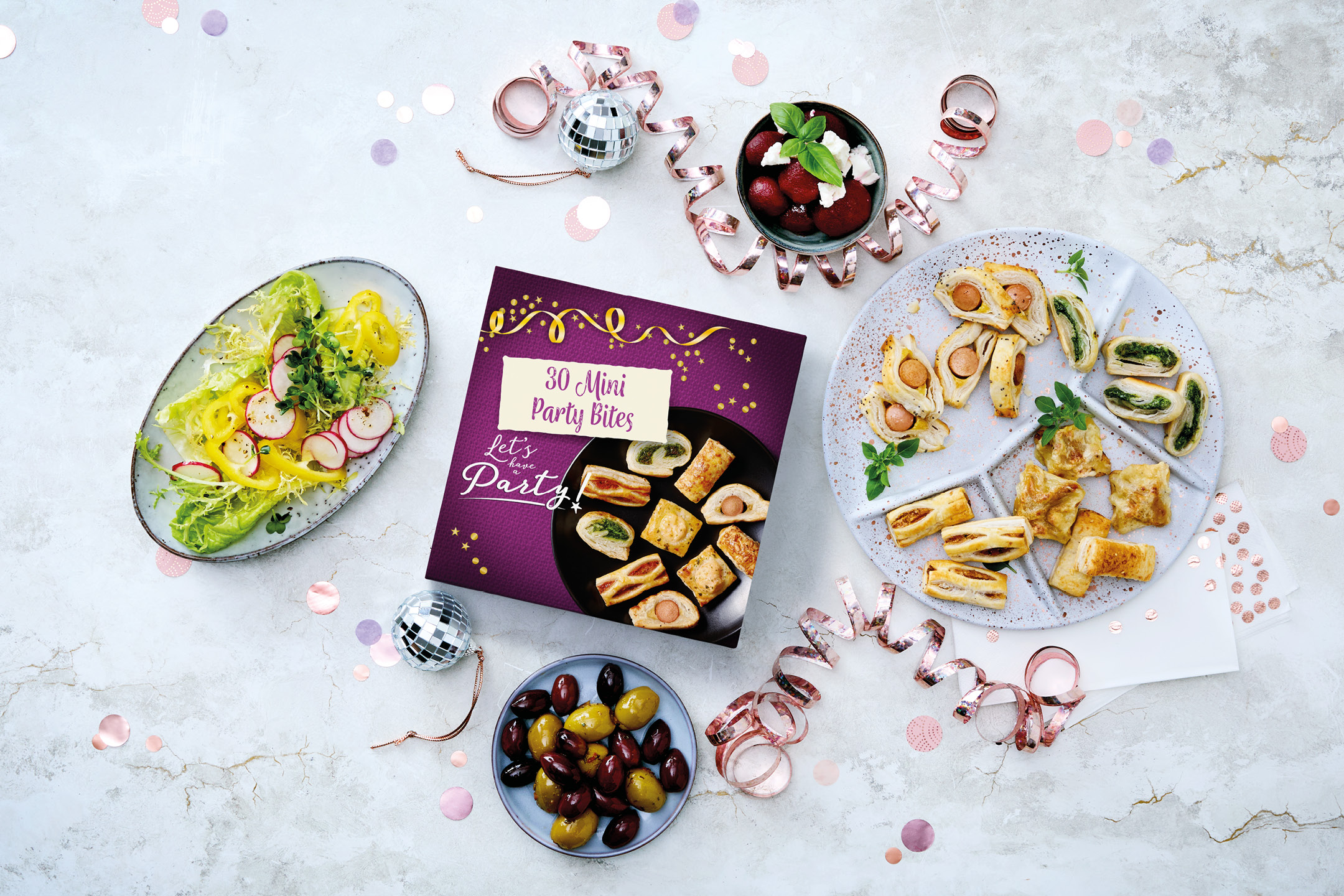 Lidl 30 Mini Party Bites box with various appetizers, salad, olives, and party decor.