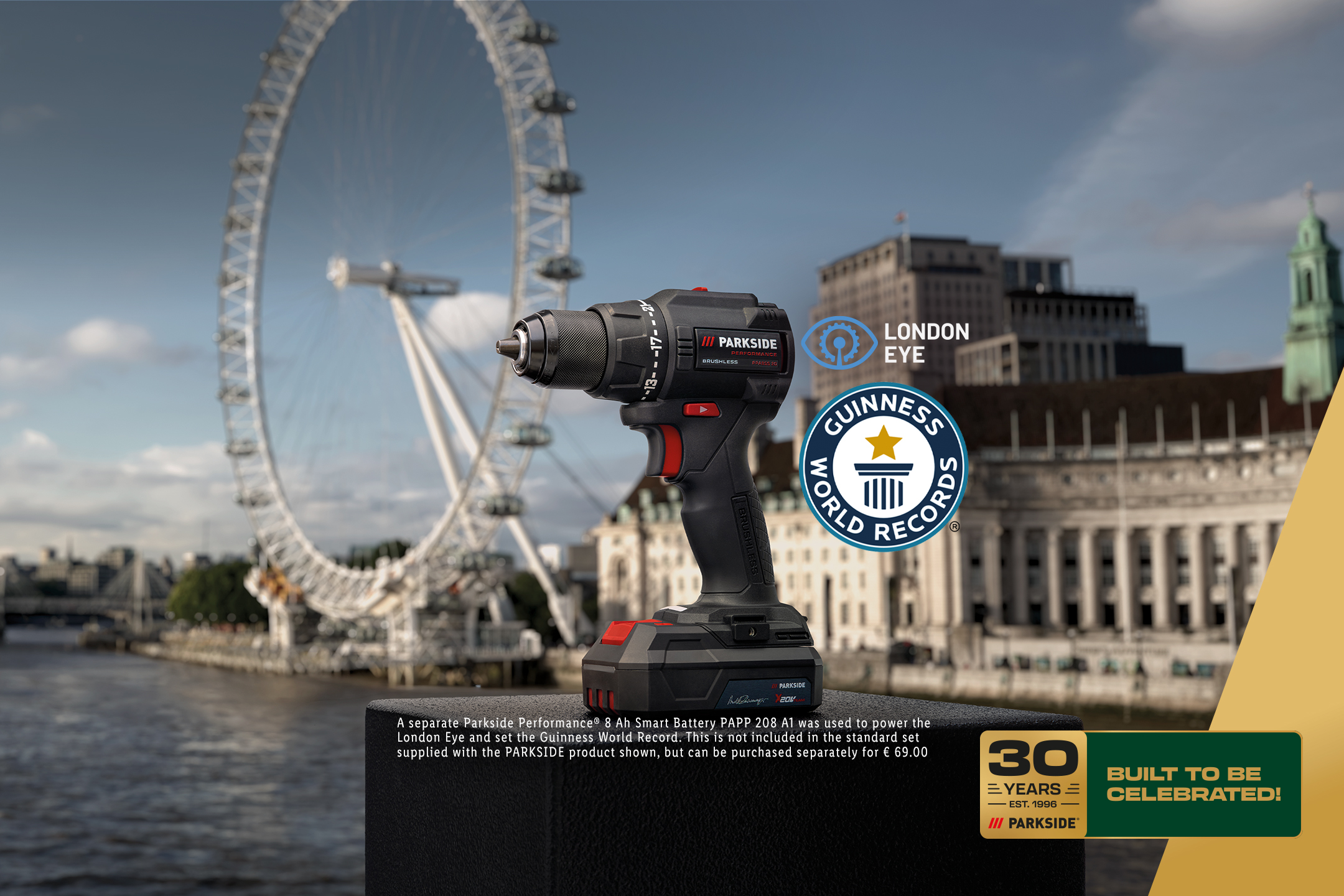 A cordless drill with a battery pack, set against the London Eye, with Guinness World Records and 30 Years Built to be Celebrated logos.