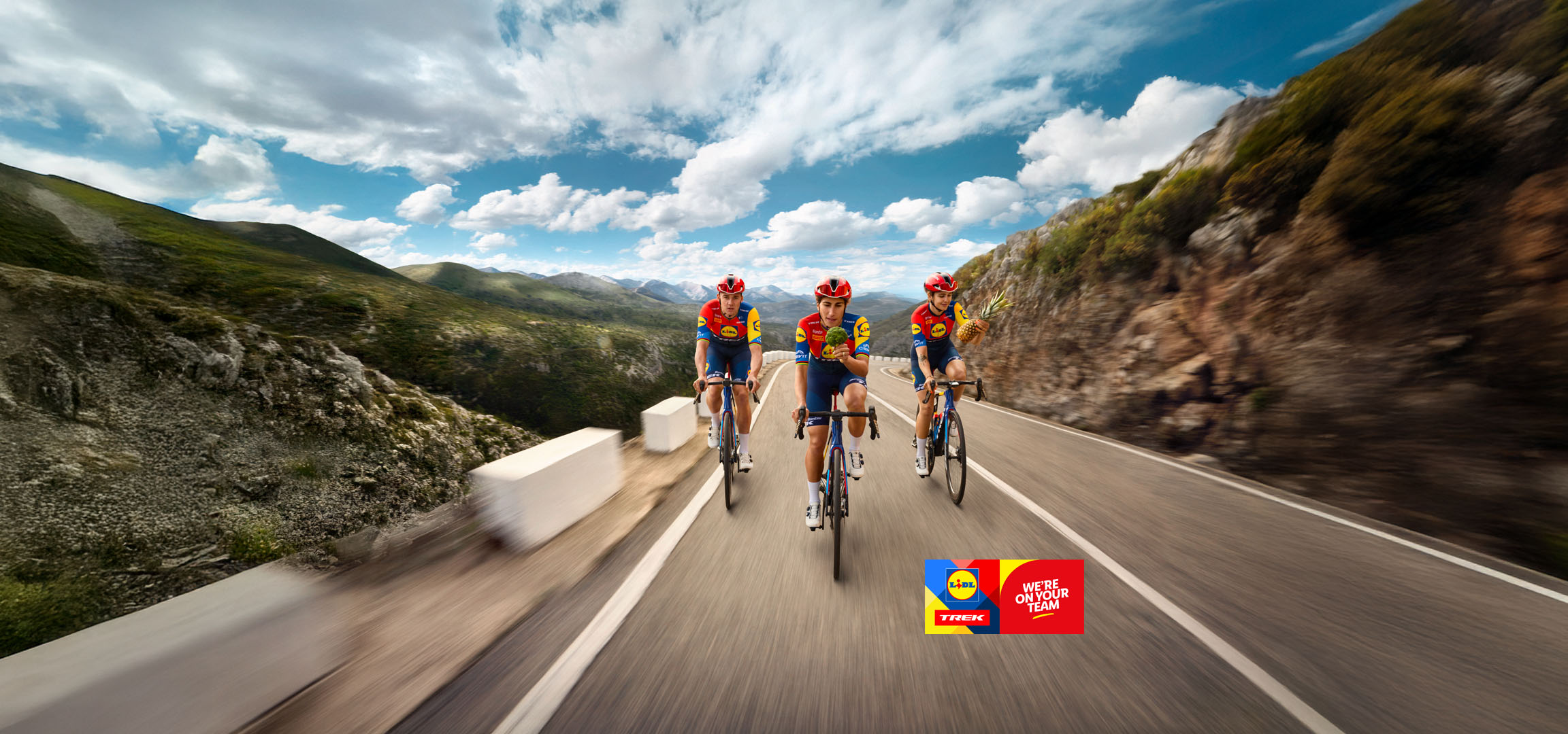 Three Lidl-Trek cyclists on a mountain road.