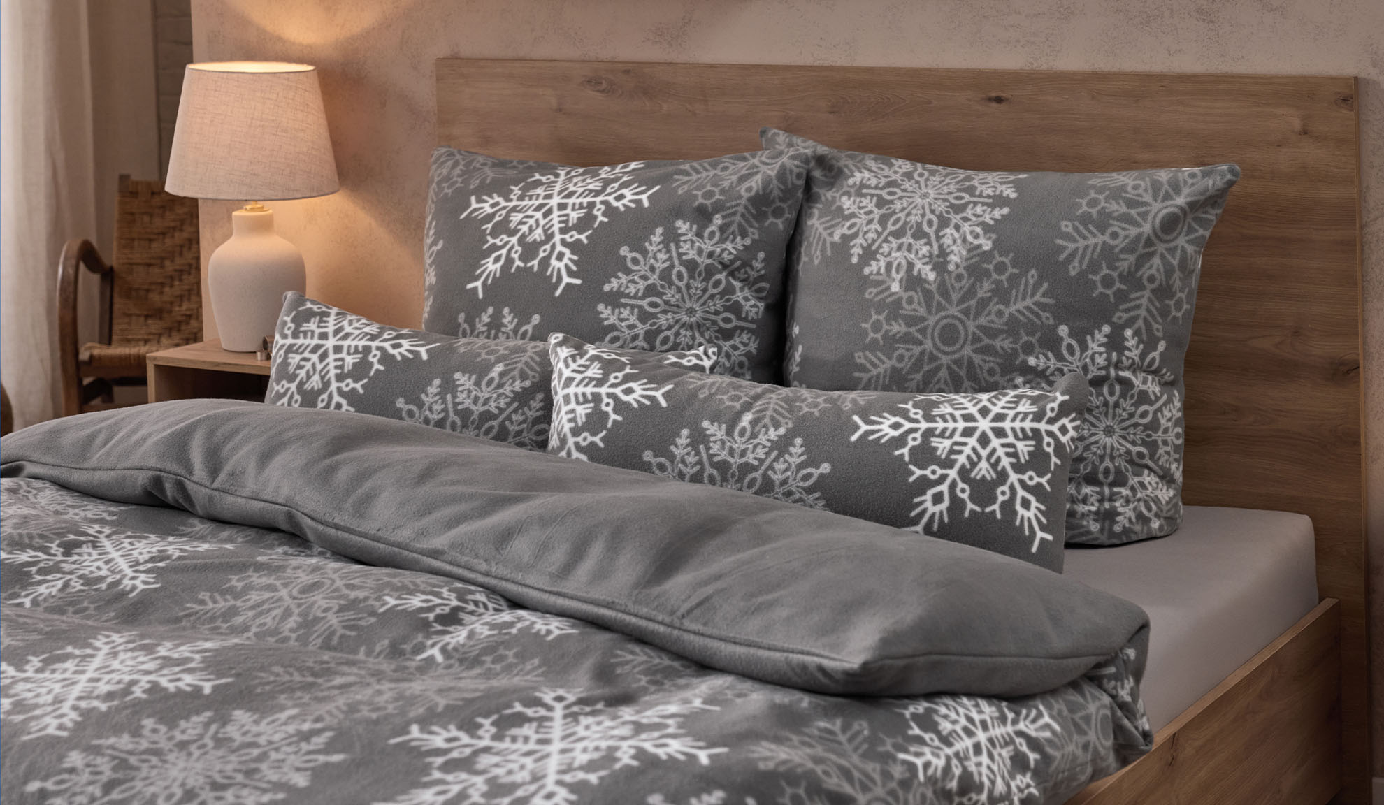 Grey bedding set with snowflake pattern in a bedroom