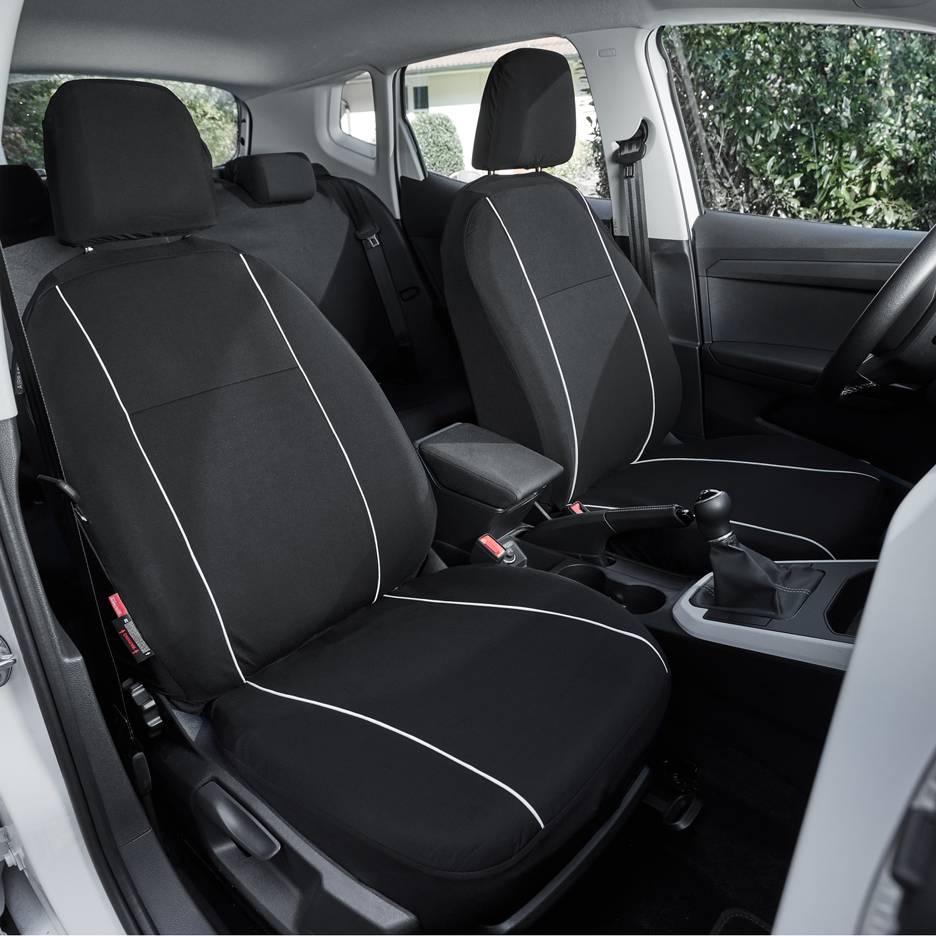 Black car seat covers with white detailing in a vehicle's interior.