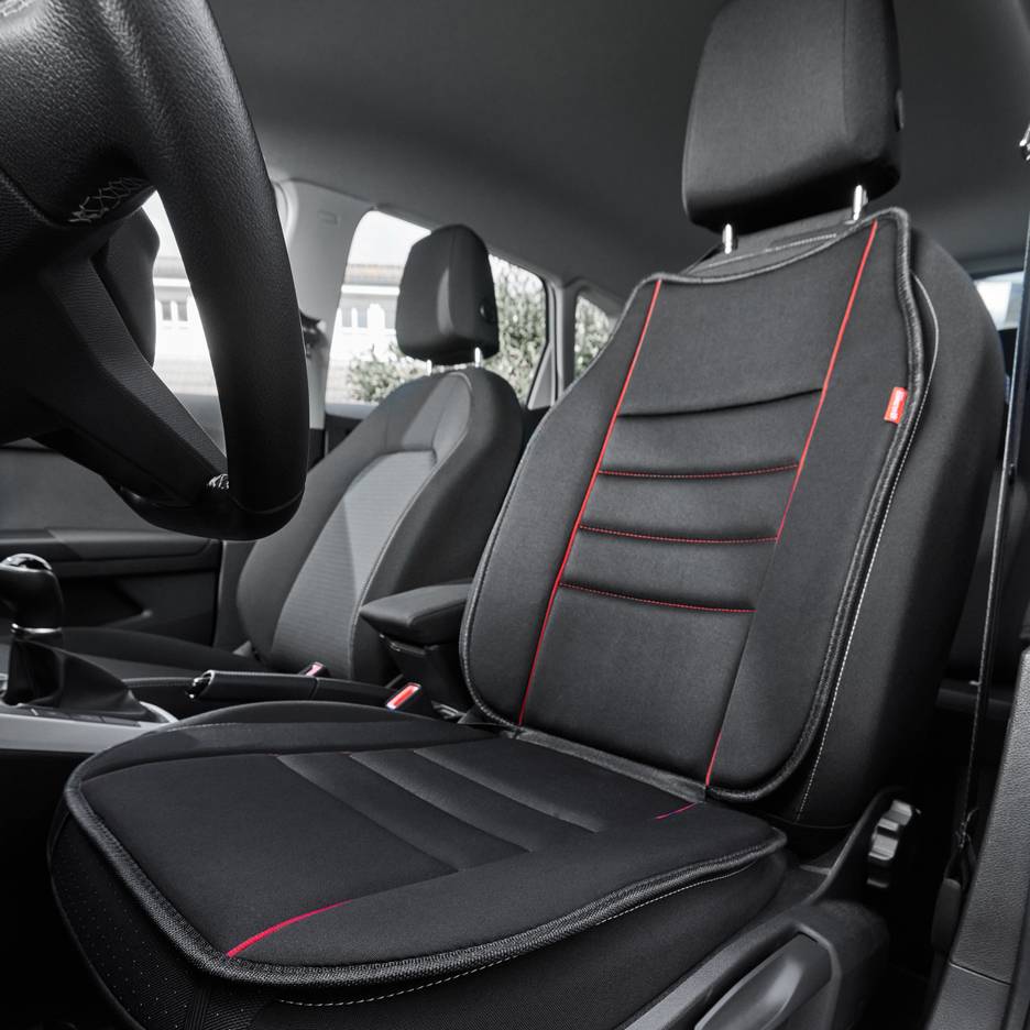 Black car seat cover with red accents, viewed from the interior of the vehicle.