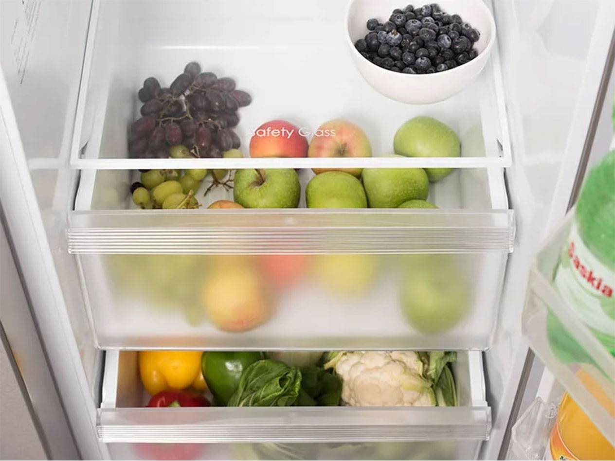 Refrigerator with fruits (apples, grapes, blueberries) and vegetables.