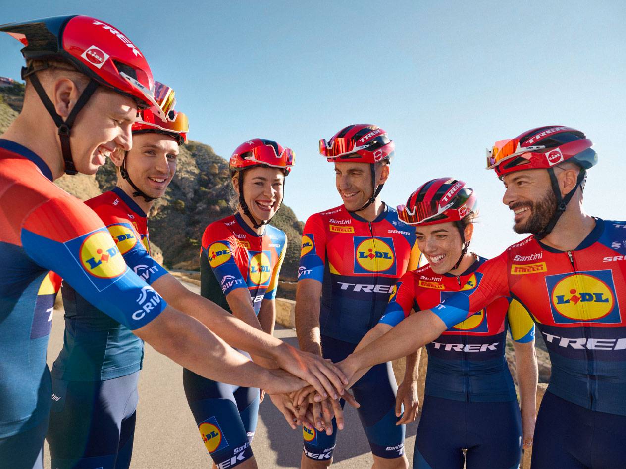 Lidl-Trek cycling team in their red and blue kits.